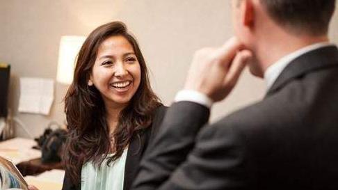 Students in meeting smiling